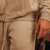 <transcy>Graue, zulaufende Jogginghose</transcy>