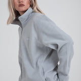 Zandkleurige sherpa-jas met 1/4 rits